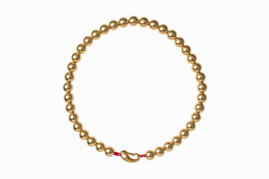 gouden ballen ketting met roze draad